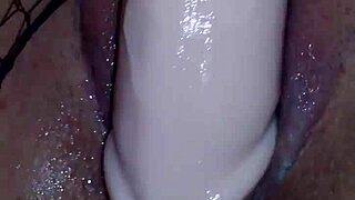 Amateur brunette explores pleasure with dildo in retro video