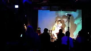 Lactating beauty performs in front of the crowd outdoors