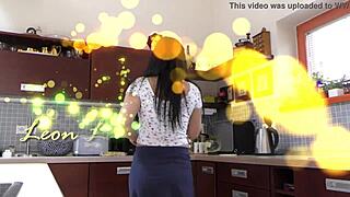 Petite babysitter's upskirt view in kitchen heats things up