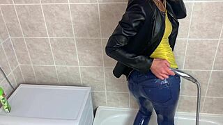 a blonde girl gets her clothes wet in a homemade video