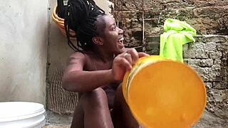 Negra Baiana Bathing in Backyard Bucket