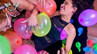 latina friends playing with balloons and showing off their sexy tits