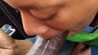 Ebony slut gives sloppy blowjob outdoors