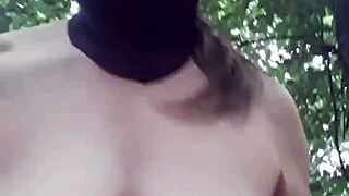 Female slave explores outdoor BDSM in forest