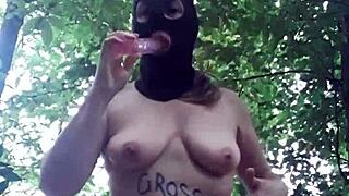 Female slave explores outdoor BDSM in forest