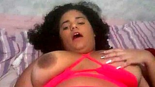 Brazilian brunette babe indulges in solo play, teasing her tight pussy with eager fingers.