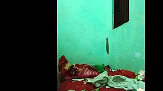 Khmer girl relaxes on the bed in her bedroom.