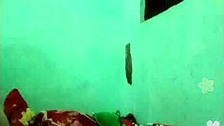 Khmer girl relaxes on the bed in her bedroom.