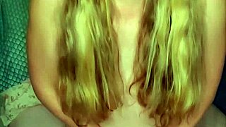 Blonde with pigtails teases herself using a pink vibrator toy