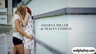 Two glamour babes pounding each other with a blue dildo on the floor.