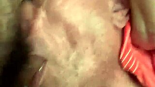 rear view of intense choking and gagging scene