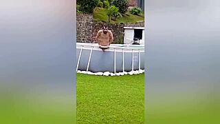 Neighbor recording naked man on farm