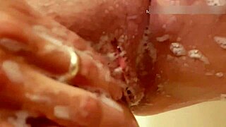 mature wife washes her natural tits and pussy