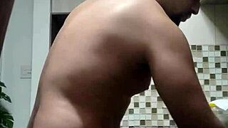 amateur macho guy washing dishes