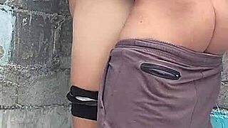 Brunette neighbor against the wall