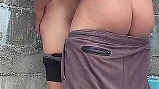 Brunette neighbor against the wall