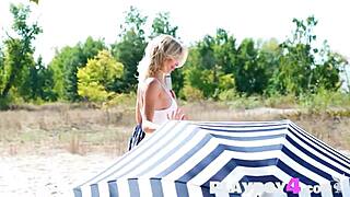 Blonde teen Eva Tali strips petite body for outdoor posing fun.