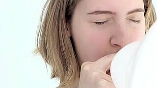 Young Looner Babe Skillfully Blows and Pops Her First Balloon