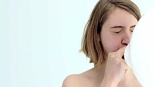 Young Looner Babe Skillfully Blows and Pops Her First Balloon