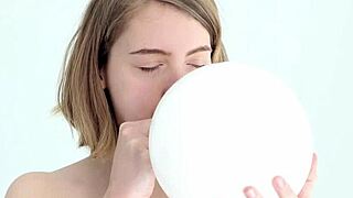 Young Looner Babe Skillfully Blows and Pops Her First Balloon
