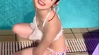 Japanese Beauty Dances Seductively with Big Boobs at Beach Pool