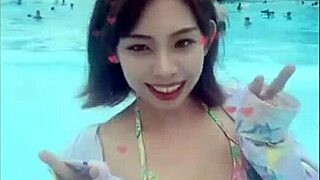 Japanese Beauty Dances Seductively with Big Boobs at Beach Pool