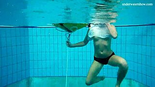 This horny teen strips naked by the pool to flaunt her tight european body in public