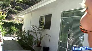 Randy Moore intensely plays in bikini outdoors