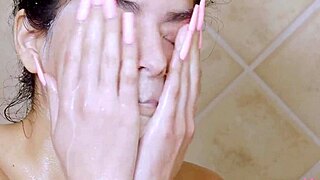 brunette beauty captivates in a steamy shower scene. her moves are pure magic for the camera.