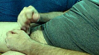 Guy jacks off watching gay sex videos