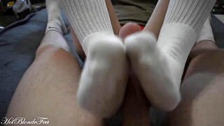 sexy blonde miley grey gives footjob in long socks