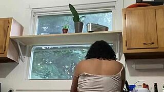 latina milf enjoys washing dishes in the kitchen