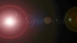 Sexy brunette dances nude by fire