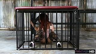 Redhead whore chained and caged for intense action