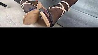 Kenia teases in black stockings and red satin dress for a stunning display