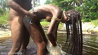 Skinny ebony hottie bathes in river while getting fucked