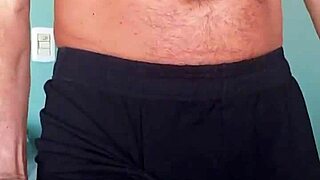 bodybuilder enjoys the soft cotton of his shorts against his bulge