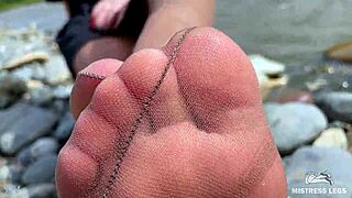 goddess in tan nylons teasing with cute soles by riverside 😍