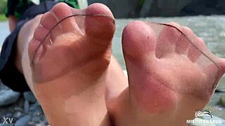 goddess in tan nylons teasing with cute soles by riverside 😍