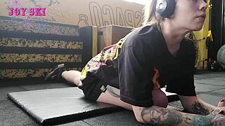 Alternative Girl Stretches At The Gym.