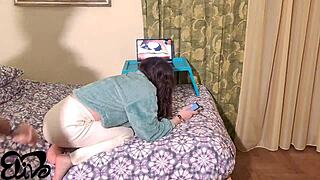 Hey, this stud is fucking me doggy style in the dorm while I watch some old hot videos!