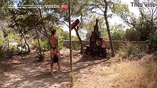 Couple Blows on Ibiza Beach with Public Walk