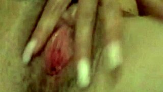 Wife intensely fingers her shaved pussy in secret