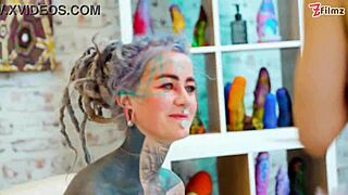 She dives into anal play with extreme dildos. Her gape widens with fisting.