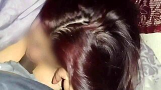 Watching movies with my neighbor while I suck his tasty cock in secret