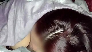 Watching movies with my neighbor while I suck his tasty cock in secret