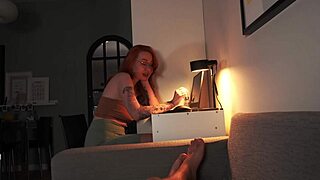 Nerdy redhead reveals tits while sucking cock