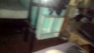 setting up tripod for naughty doggystyle in short floral dress