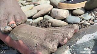 i show you my messy nylon feet close-ups in torn pantyhose on the river bank.