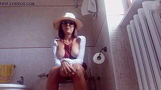 Brunette on toilet caught by hidden cam while farting loud.